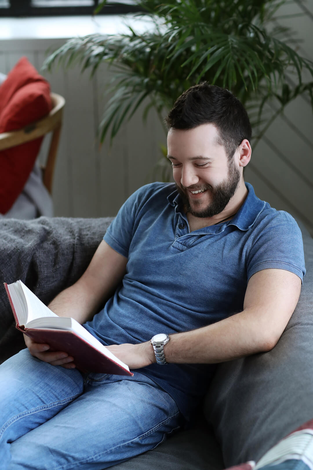 young man reading a Spanish book