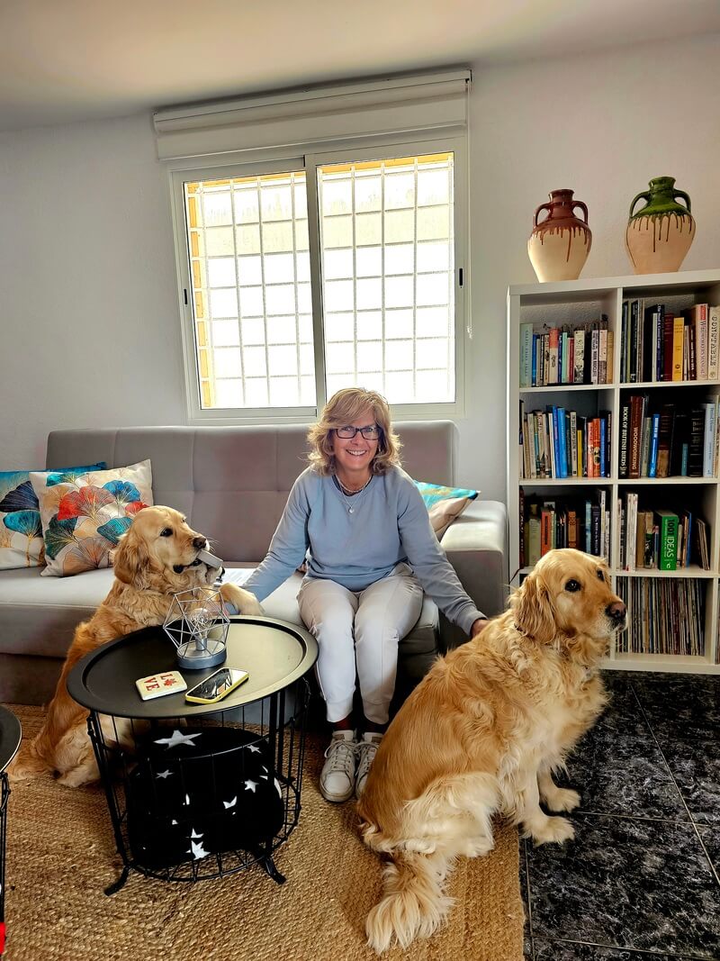 50+ year old spanish student stays in her teacher's home in Barcelona and pets her teacher's dogs before beginning their daily Spanish lesson