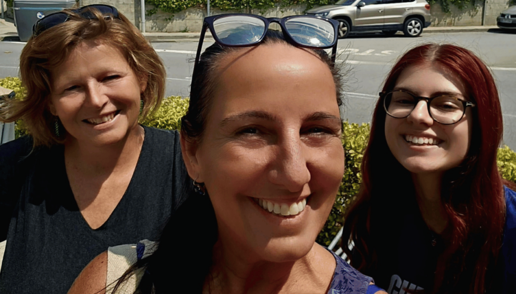 Anne, Lydia, and Monica at Dosrius – Posing with the Town Hall in the Background