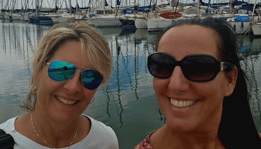 Christine and Monica at Mataró Port – Watching Sailing Boats Drift into the Mediterranean