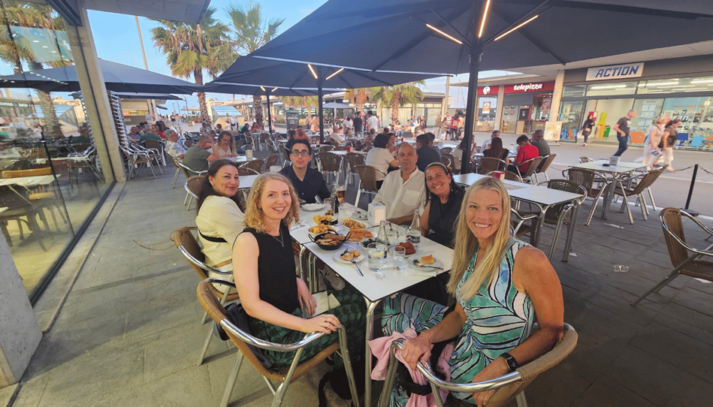 Karen, Riona, and Friends at Premià de Mar Port – Tapas, Sea Breeze, and Good Company