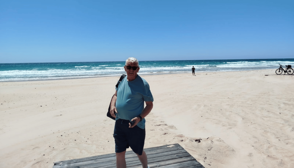 Sun, sea, and Spanish — Paul enjoying every moment at the Playa de Cádiz.