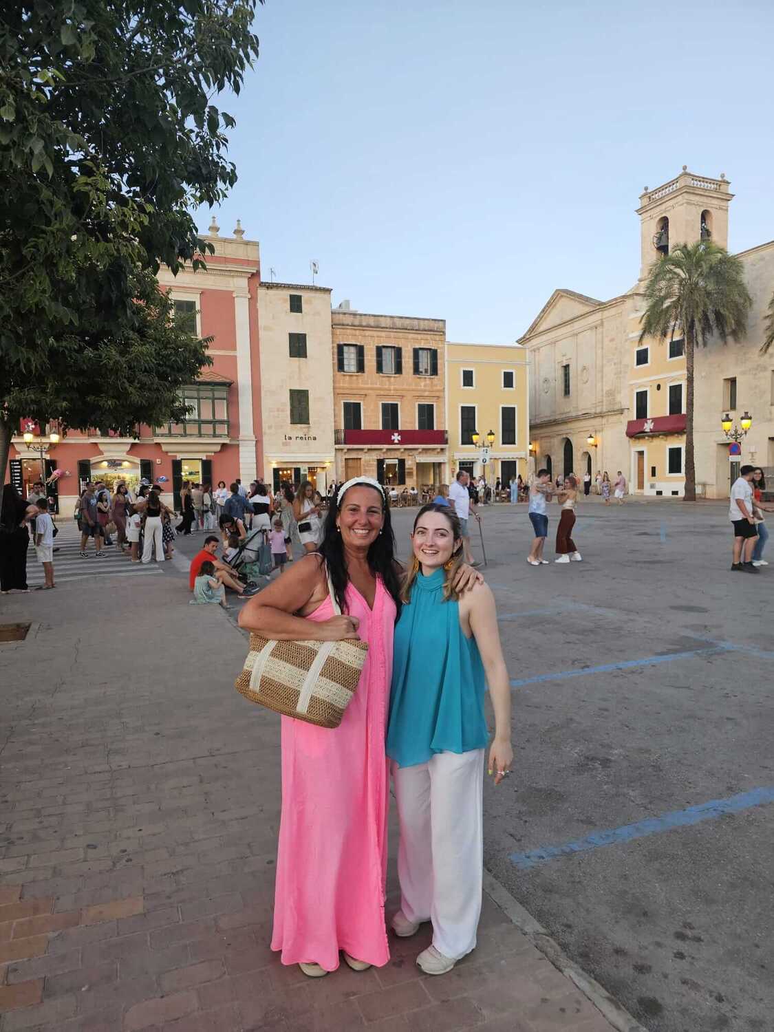 student and teacher in a square in Menorca